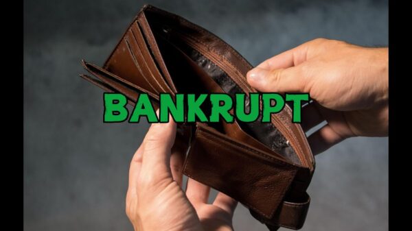 A picture of two hands opening an empty wallet, with the word bankrupt in green over the wallet.