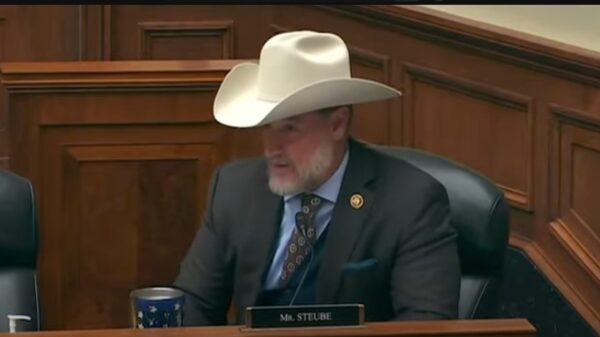 Florida Congressman Greg Steube speaking at his house seat, wearing a cowboy hat