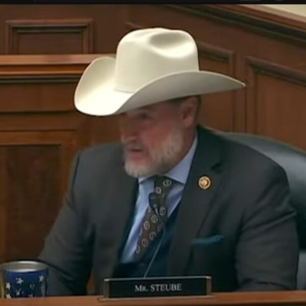 Florida Congressman Greg Steube speaking at his house seat, wearing a cowboy hat