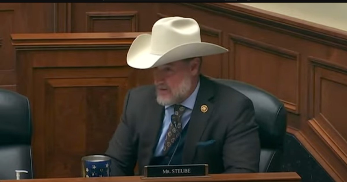 Florida Congressman Greg Steube speaking at his house seat, wearing a cowboy hat