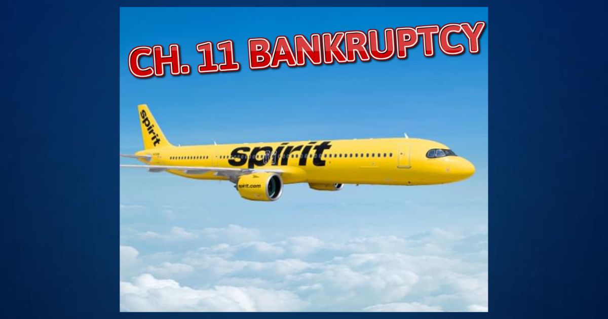 A yellow-colored passenger jet plane with the word Spirit on the side.